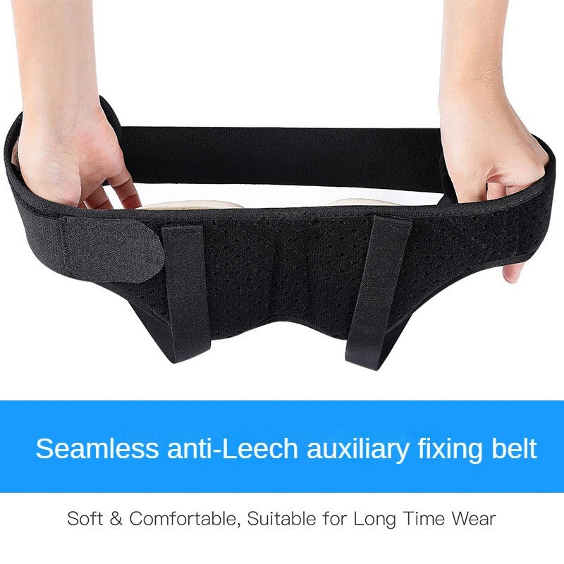 Hands holding a black Fitlybuy hernia support belt with adjustable compression pads and straps on a white background.