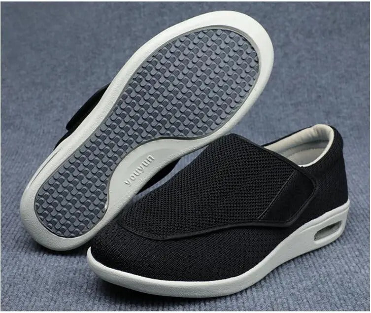 Fitlybuy ComfortStride black mesh orthopedic walking shoes with white cushioned sole, velcro strap, and textured tread.