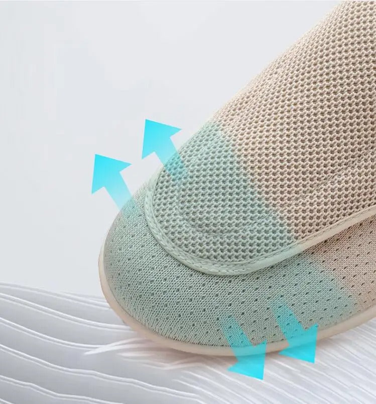Close-up of a beige Fitlybuy orthopedic walking shoe featuring breathable mesh fabric and adaptive arch support graphics.