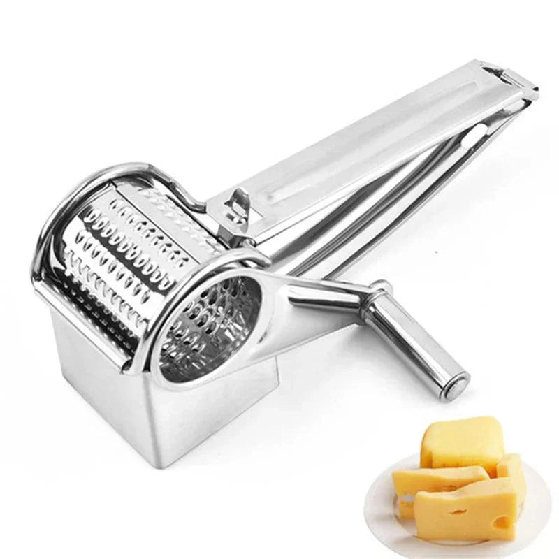 Fitlybuy stainless steel rotary cheese grater with hand crank, shown next to a small plate of cubed cheese.
