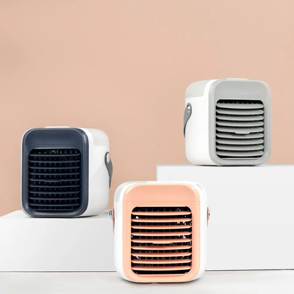 Three Fitlybuy 3-in-1 portable mini air conditioners in blue, gray, and peach on white platforms against beige.