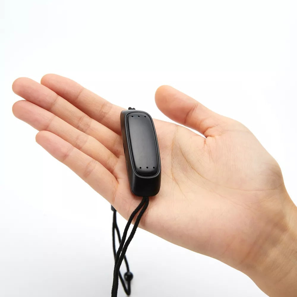 Fitlybuy black smart anti-snoring device held in a palm, featuring a sleek, compact design with an adjustable strap.