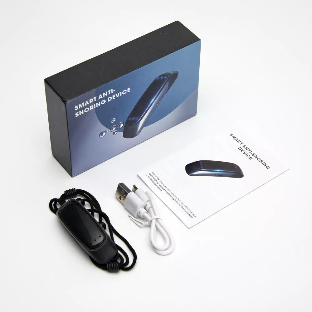 Fitlybuy anti-snoring device kit: black device with strap, USB charging cable, user manual, and branded product box.