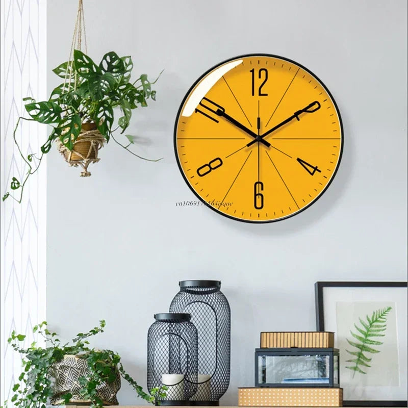Minimalist round wall clock with a yellow face and black accents, hanging in a stylishly decorated home office.