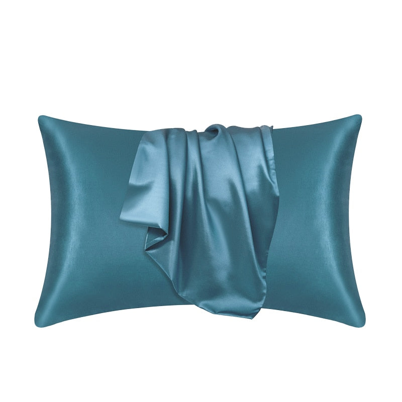 Teal Fitlybuy satin pillowcase with SoftTouch fabric, showing a smooth, draped texture on a white background.