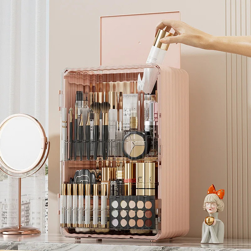 Fitlybuy Luxo pink, dust-proof makeup organizer with magnetic door holding brushes, lipsticks, and palettes on a vanity.