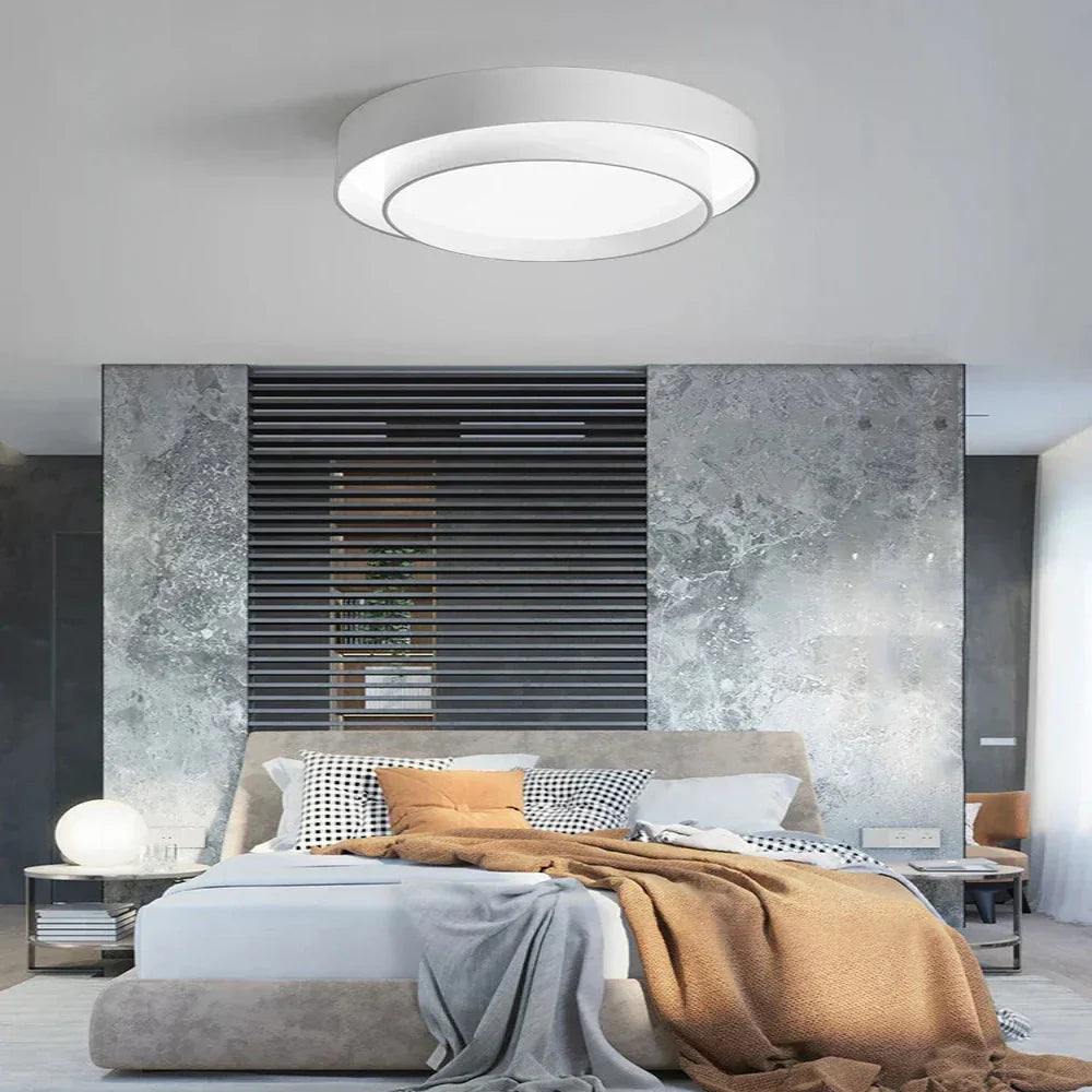 Fitlybuy NordicAura white minimalist LED ceiling light with EcoBright technology in a modern bedroom.