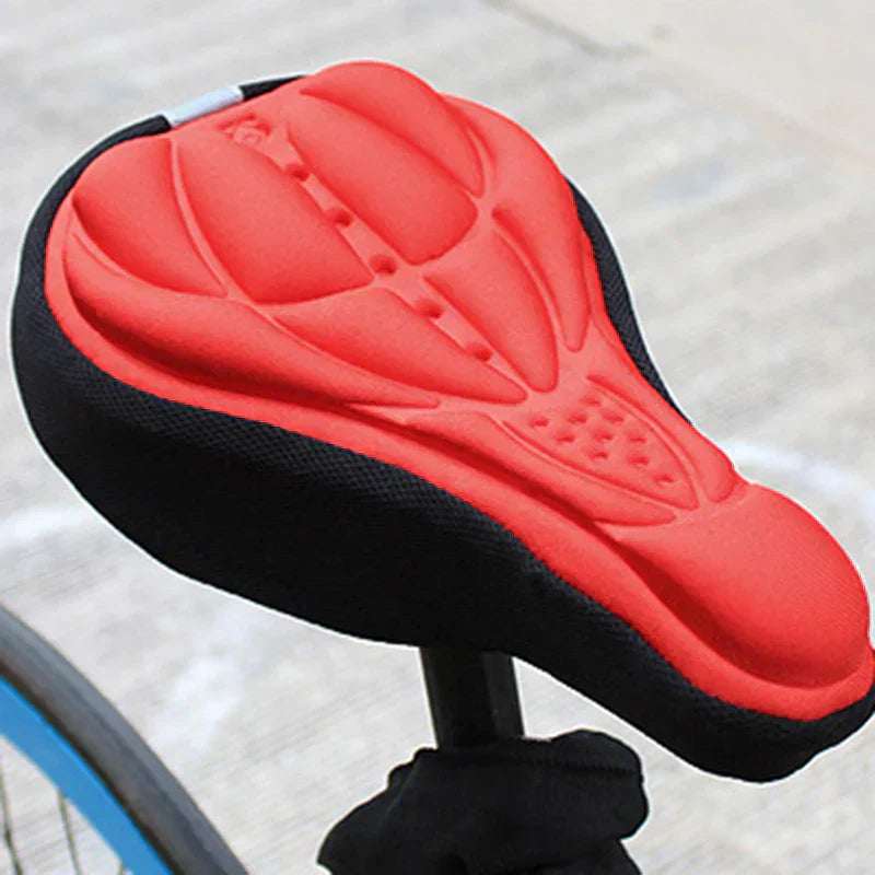 Fitlybuy ComfortRide red and black gel bike seat cover with ergonomic contoured cushioning on a bicycle seat.