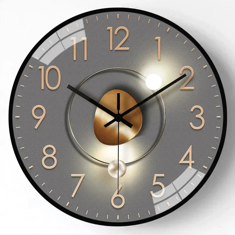 Fitlybuy silent wall clock with a grey dial, rose gold numbers, gold center accent, and a pearl-like pendulum.