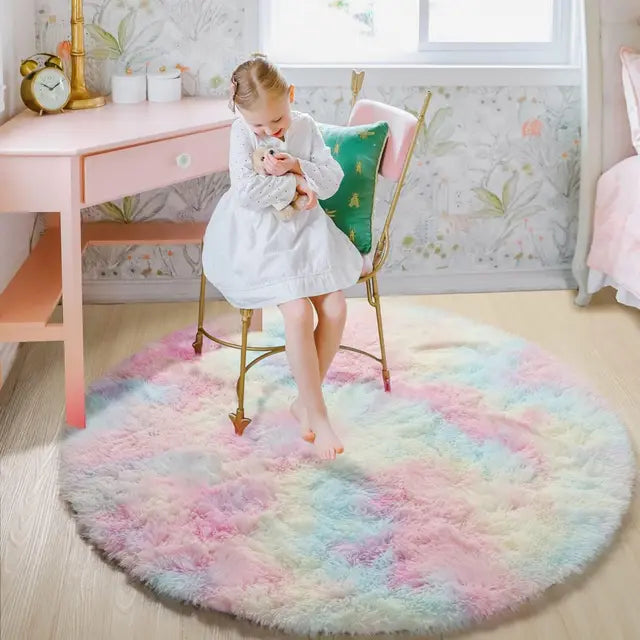 Fitlybuy FluffyMat: Round, ultra-soft, multi-colored pastel plush rug in a girl's bedroom with CozyCloud technology.