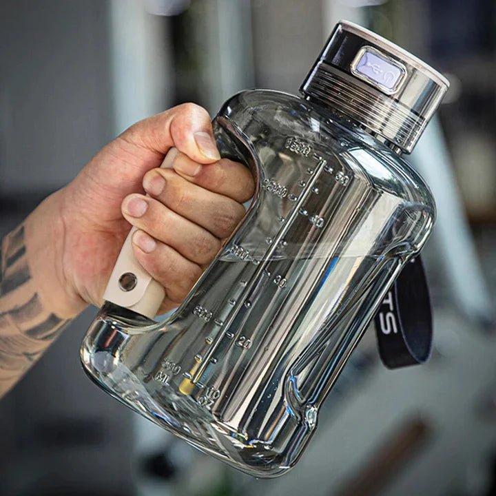 Fitlybuy hydrogen water bottle with clear tank, volume markings, ergonomic handle, and USB charging cap.