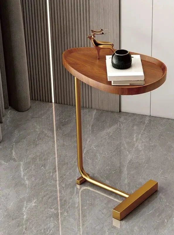 Fitlybuy modern oval wooden side table with a C-shaped gold metal frame, styled on a grey marble floor.