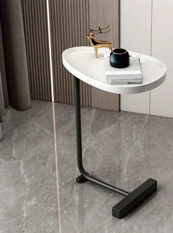 Modern Fitlybuy C-shaped side table with a white marble-look top and black metal base in a stylish living room setting.