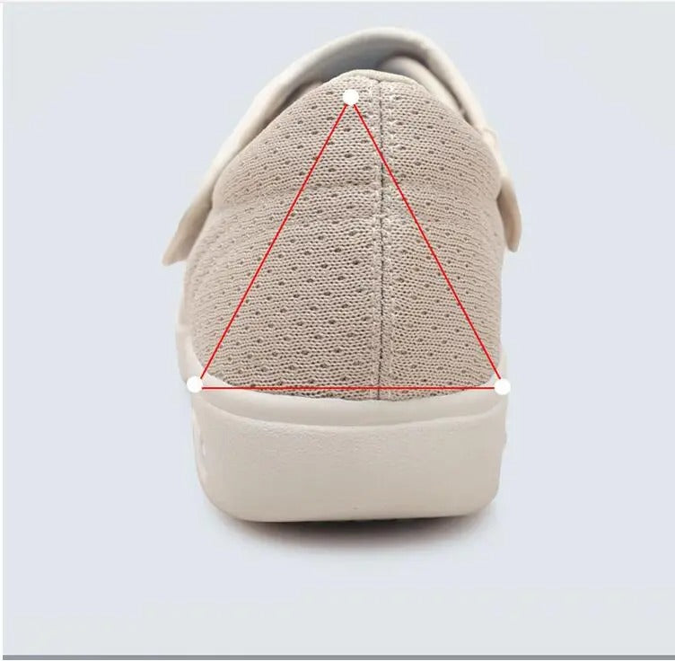 Beige Fitlybuy ComfortStride orthopedic walking shoe, back view showing mesh material and arch support diagram.