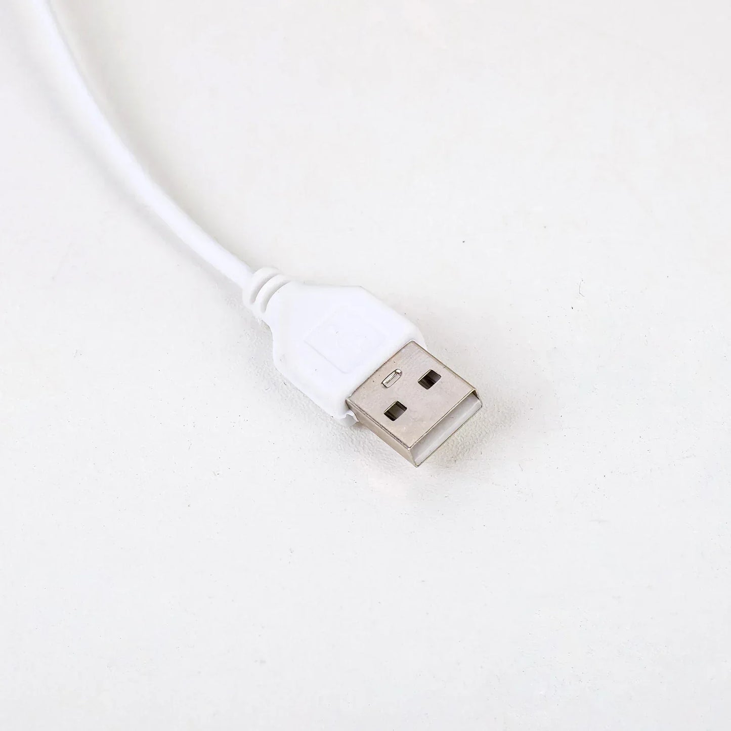 White USB power cable for the Fitlybuy AuraStone Amethyst Serenity Lamp on a white background.