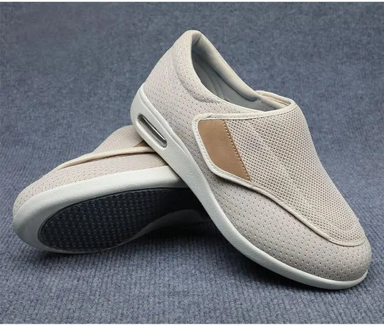 Fitlybuy ComfortStride beige mesh orthopedic walking shoes with side air cushion and tan accent on gray carpet.