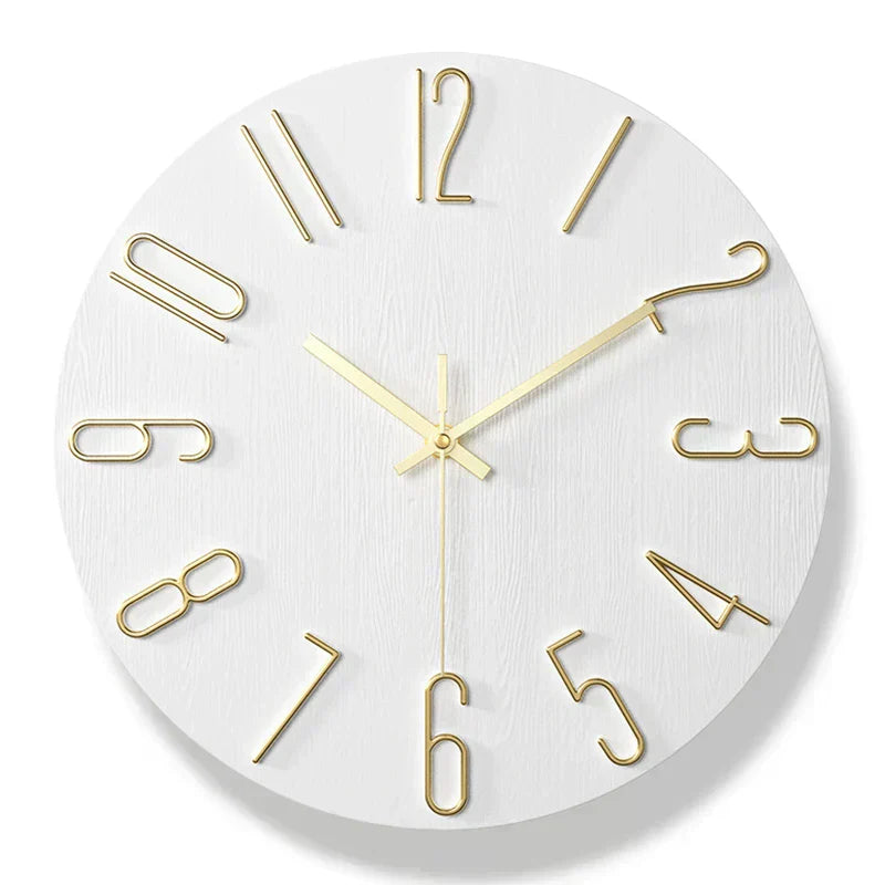 Fitlybuy Scandinavian white wooden wall clock with gold-tone wire numerals and silent hands on a clean, frameless face.