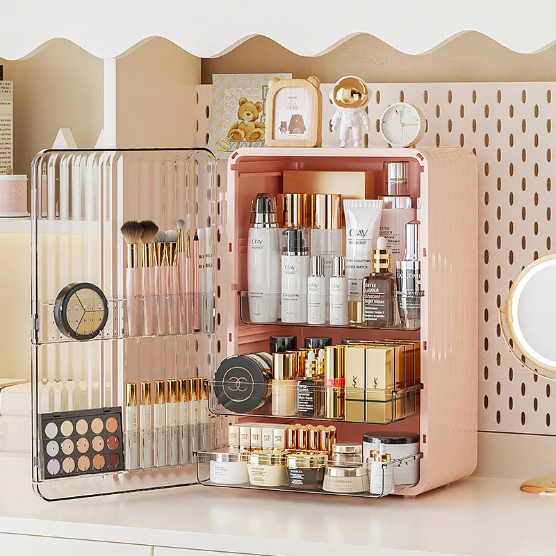 Fitlybuy Luxo pink makeup storage box with a transparent magnetic door holding beauty products on a white desk.