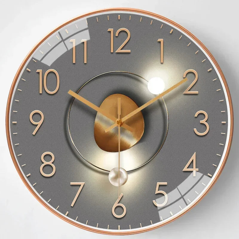 Fitlybuy silent wall clock with a grey face, rose gold numerals, center metallic accent, and glass finish.