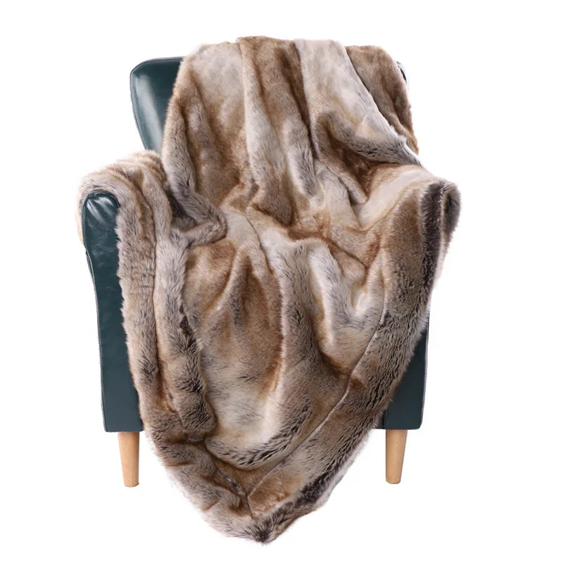 Fitlybuy soft, luxurious brown and cream faux mink fur throw blanket draped over a dark green modern armchair.