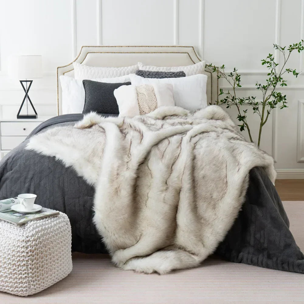 Fitlybuy luxury white faux fox fur throw blanket draped over a charcoal grey bed in a modern, elegant bedroom setting.