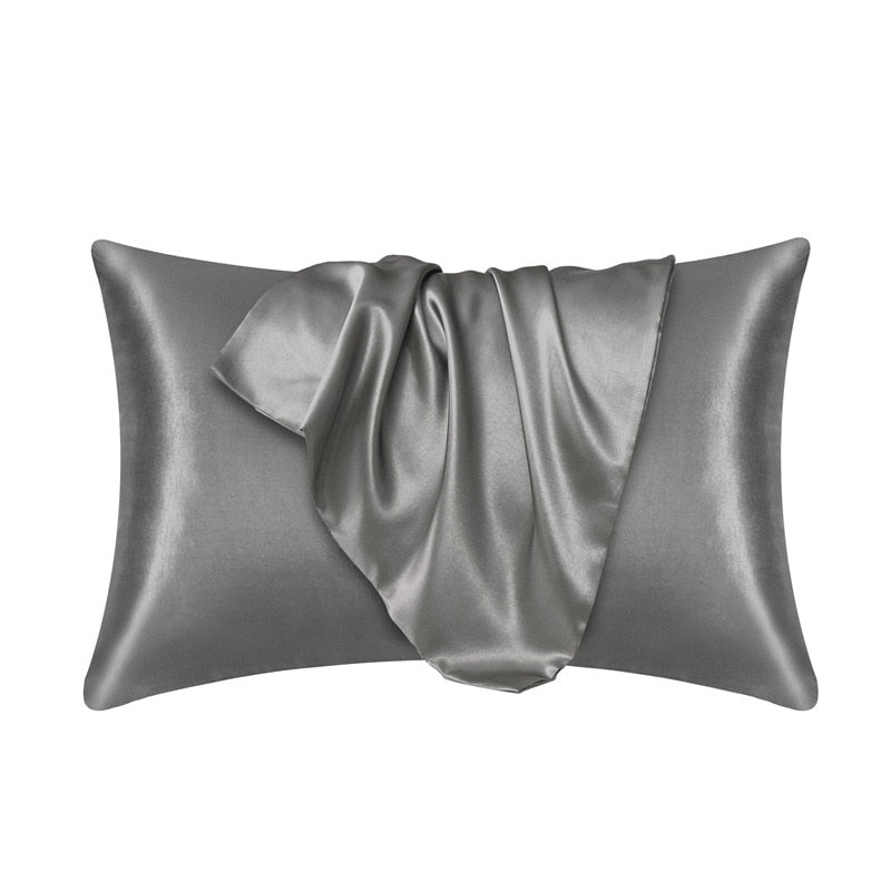 Fitlybuy grey satin pillowcase featuring SoftTouch fabric with a smooth, draped texture isolated on a white background.