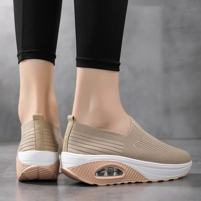 Fitlybuy beige orthopedic slip-on shoes with knit uppers, thick white cushioned soles, and visible air support pods.