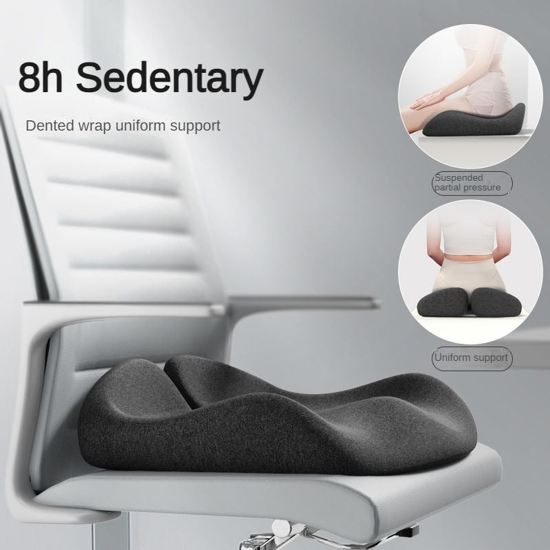 Dark gray ergonomic sciatica seat cushion on a white office chair, showing pressure-relieving support for long sitting.