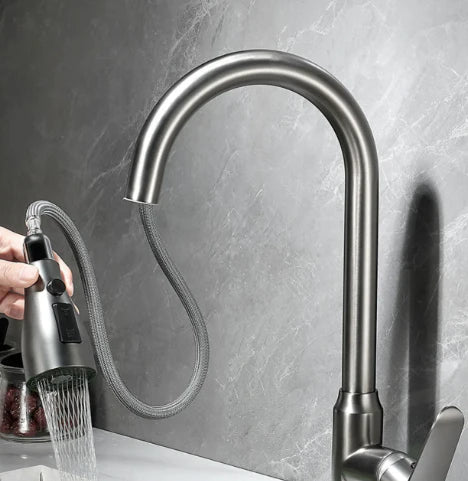 Fitlybuy Velvra matte black pull-out kitchen tap with dual spray and single lever against a marble-style background.