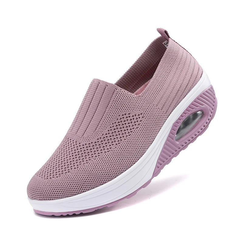 Fitlybuy mauve knit slip-on orthopedic shoe with white cushioned sole, side air pocket, and non-slip tread.