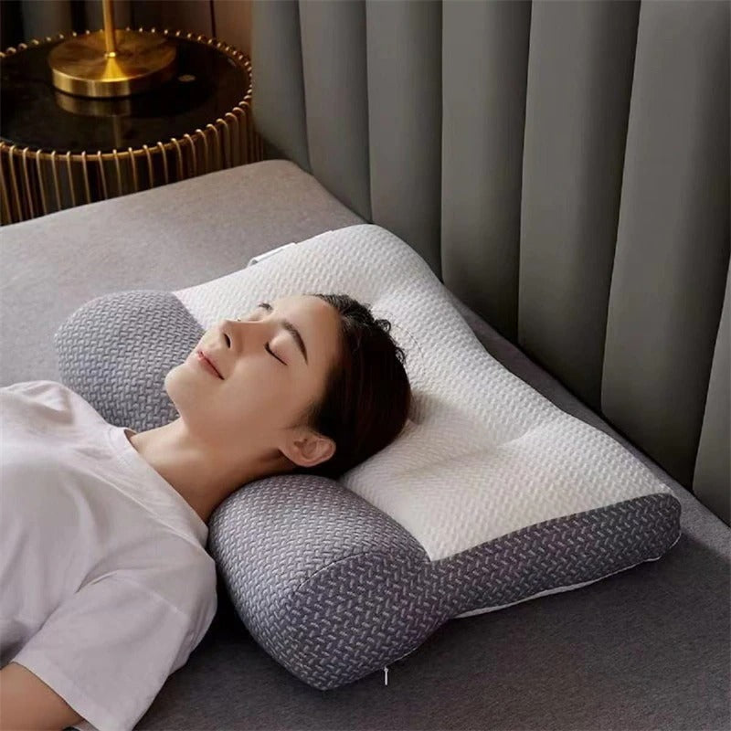 A woman rests on a white and gray Fitlybuy ergonomic memory foam pillow, designed for neck support and pain relief.