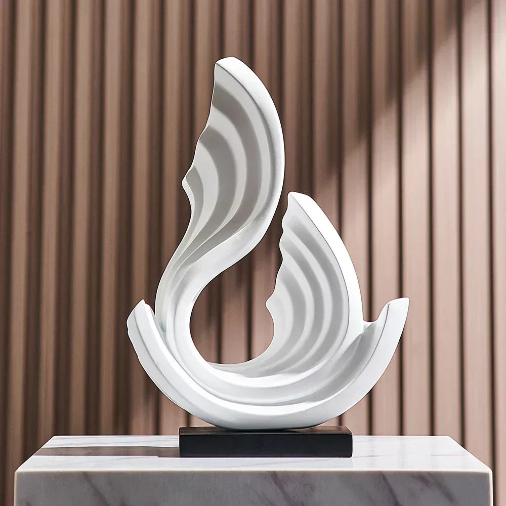 Fitlybuy Ethereal Flow white, wave-patterned abstract ornament on a black base, set on a marble pedestal.