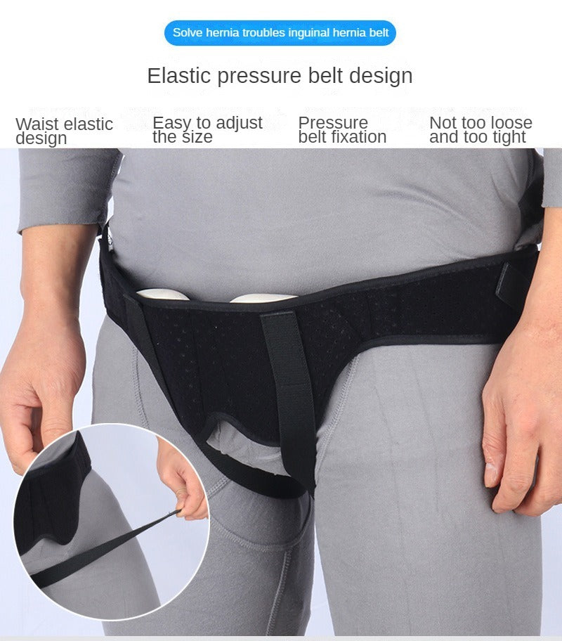 Fitlybuy hernia support belt in black with adjustable compression pads, worn over grey clothing to show fit and function.