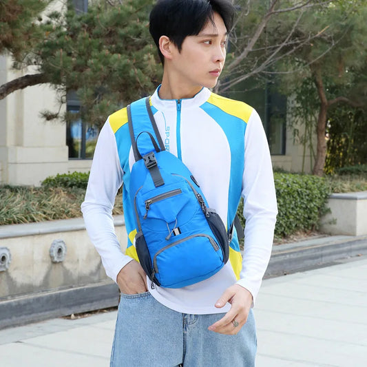 Man wearing a blue Fitlybuy waterproof anti-theft shoulder backpack with multiple pockets outdoors.