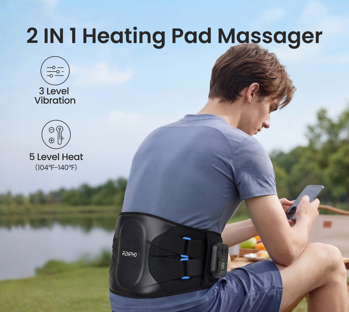 Man wearing a black cordless back massager waistband with heat and vibration settings, outdoors near a lake.