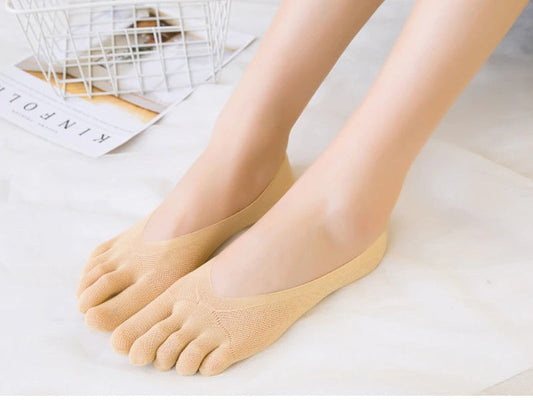 Fitlybuy beige no-show toe socks with arch support worn on feet, on a white surface with a wire basket in background.