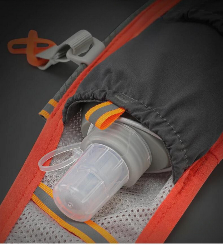 Fitlybuy trail running hydration vest featuring a grey soft flask, black pocket, and orange trim on mesh straps.