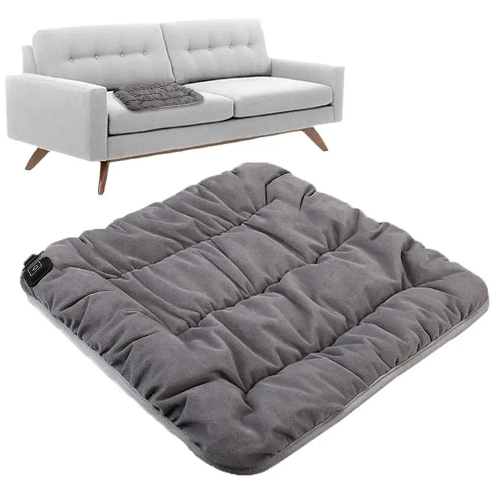 Fitlybuy gray, tufted, USB rechargeable heated seat cushion with power control, shown on a light gray sofa.