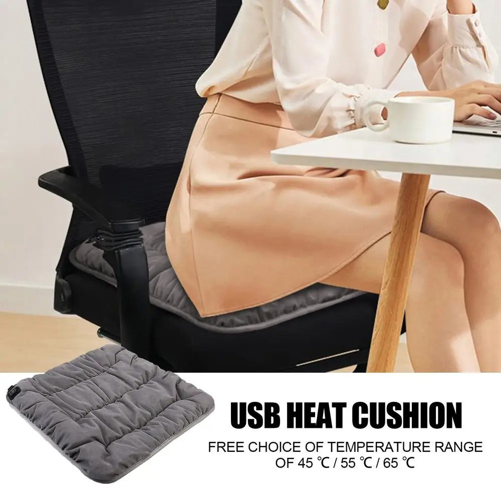 Gray USB rechargeable heated seat cushion on office chair with adjustable temperature settings shown in office context.