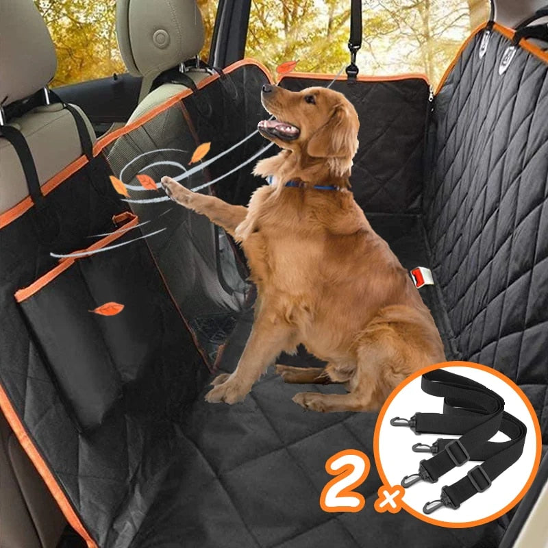 Golden retriever sits on a black quilted, waterproof Fitlybuy dog car seat cover with orange trim and two seatbelts.