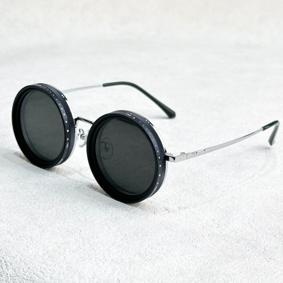Fitlybuy round polarized sunglasses with a silver metal frame and adjustable light-reduction dials on black lenses.
