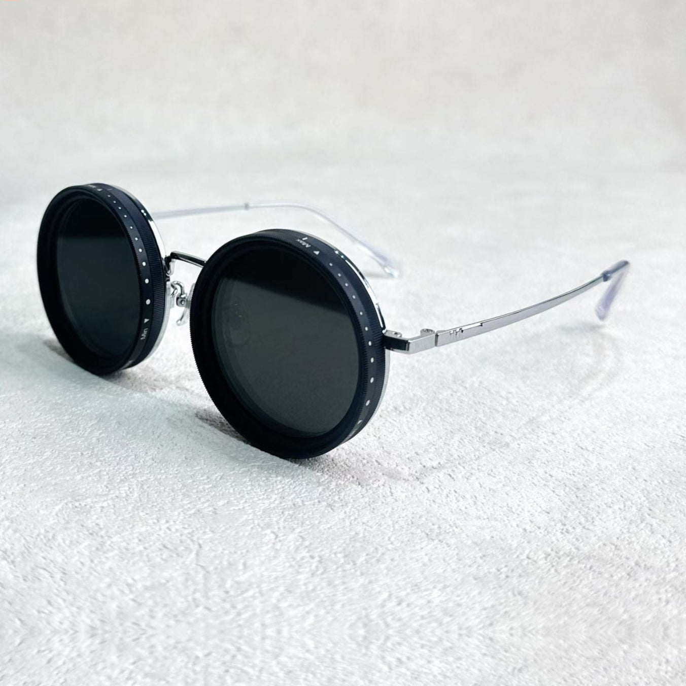 Fitlybuy round polarized sunglasses with silver metal frames and adjustable black light-reduction dials.