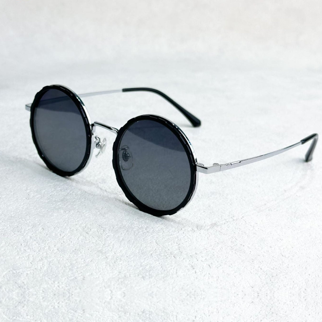 Fitlybuy round polarized sunglasses with silver metal frames and textured black rims on a white textured background.