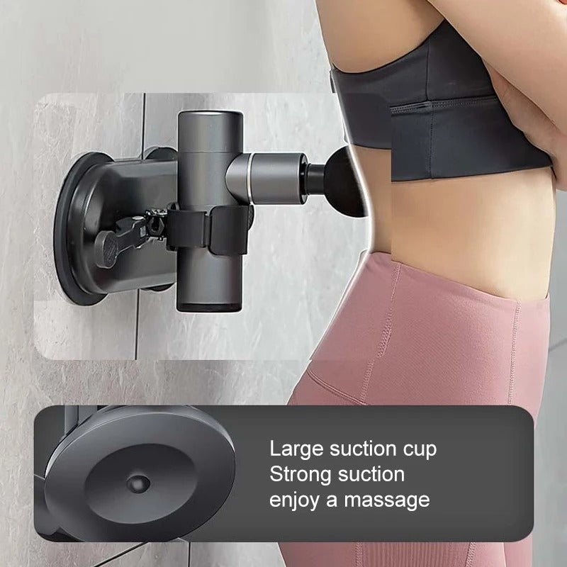 Fitlybuy grey massage gun wall mount with SecureGrip suction cup holding a device against a person's lower back.