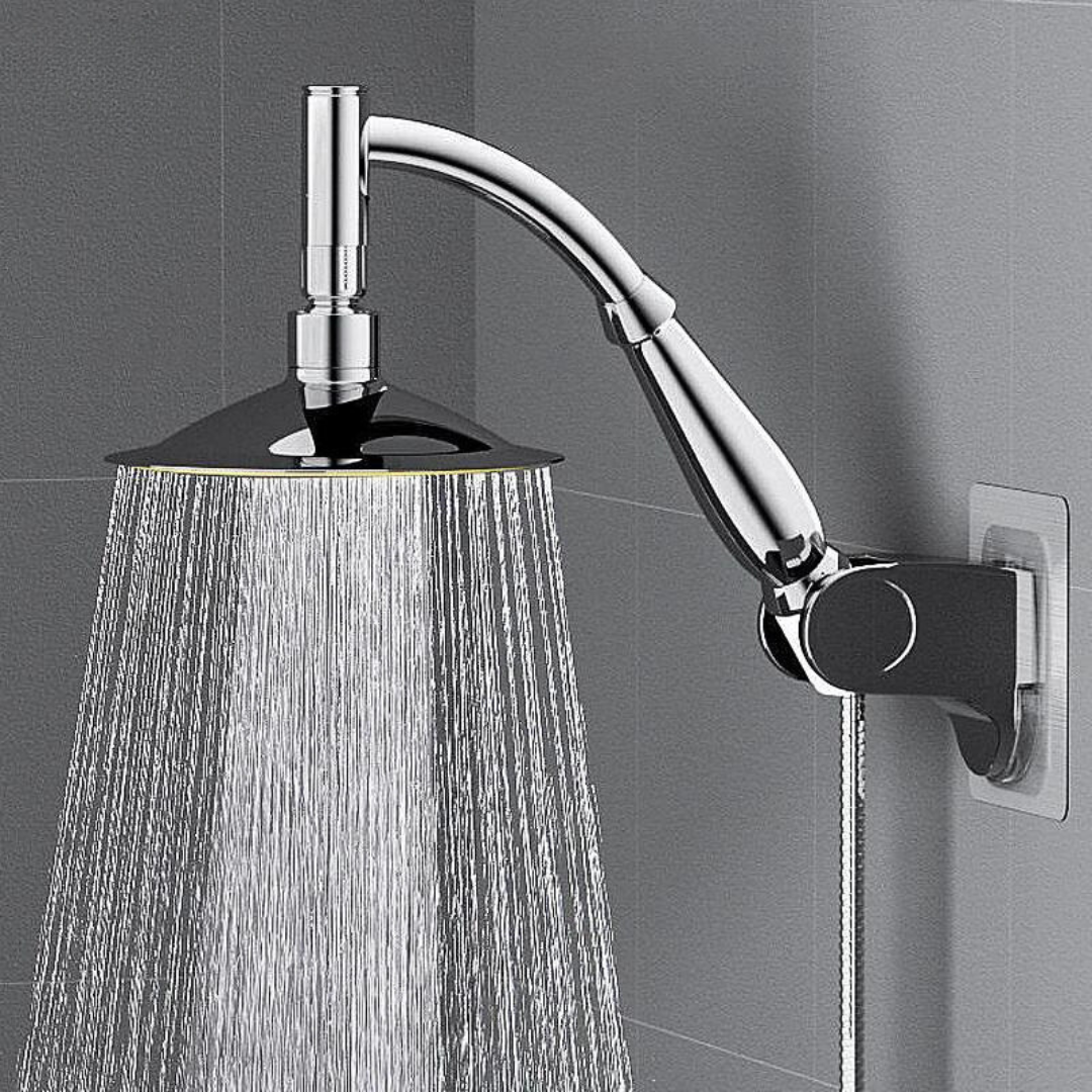Fitlybuy RainZen chrome shower head mounted on a gray tile wall, spraying water with EcoFlow efficiency technology.
