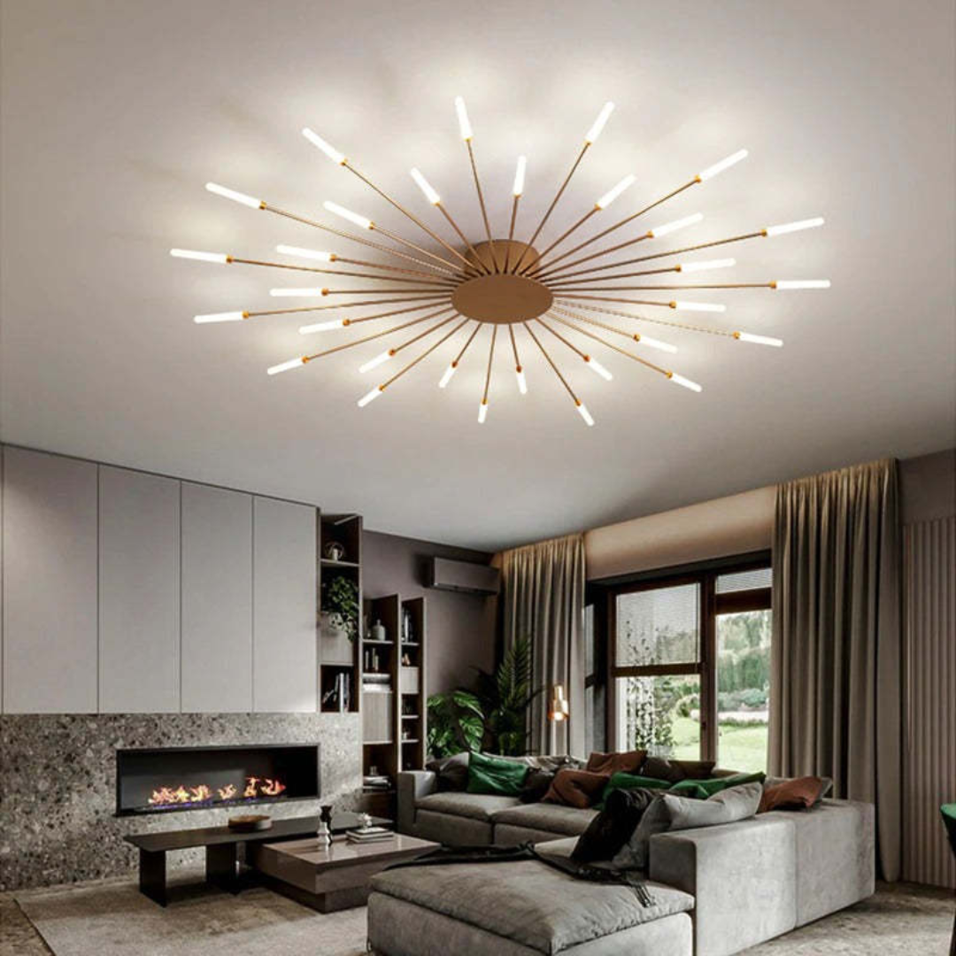 Fitlybuy modern gold sunburst LED ceiling light illuminating a contemporary living room with a fireplace and sofa.
