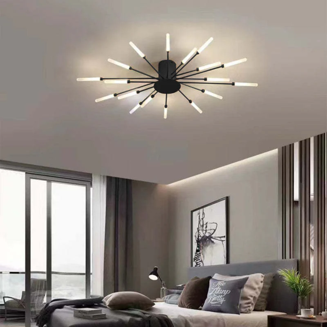 Fitlybuy modern black starburst LED ceiling light with multiple glowing rod arms installed in a contemporary bedroom.