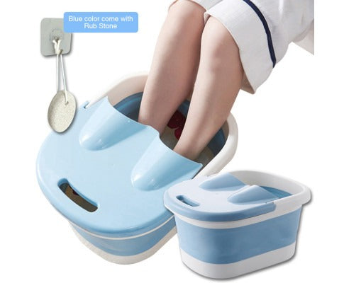 Foldable blue and white Fitlybuy foot spa bucket with heat therapy, shown in use with an included pumice rub stone.