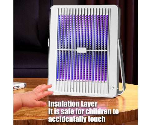 Fitlybuy electric insect killer with purple light, white safety-grid design, on a table near a child's hand.