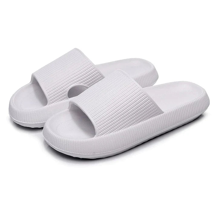 Pair of white Fitlybuy Cloud Slides with a thick, textured ComfortFoam cushioned sole on a white background.